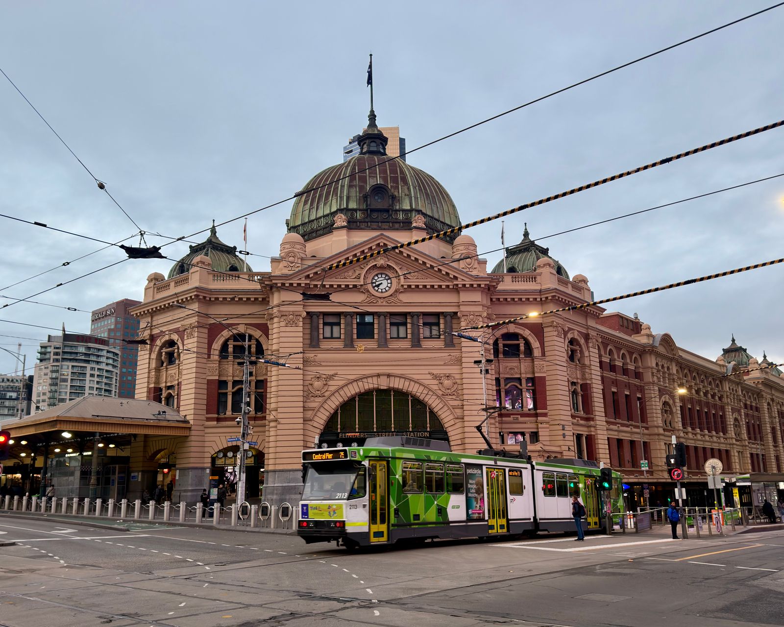 A Melbourne street with trams and terrace housing